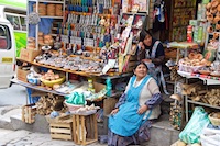 Photo from Susan's Story, A colorful Aymara woman selling her goods in the witches market in La Paz