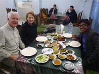 Photo of Salman, Susan, and Hugh eating in Bangladesh