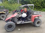 Photo from Susan's Story, Susan in her 4-wheeler ready to take on the rugged logging roads around Ketchikan, Alaska