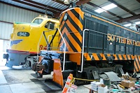 Photo from Susan's Story, Two of the historic railroad engines in one of the buildings of the Orange Empire Railroad Museum