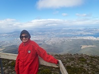Susan's Story, Susan on the top of Mt Wellingtonin Tasmania, we would bicycle all the way to the harbor in Hobart!